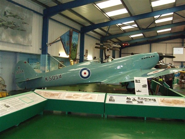 Photo:A tribute to R. A. Mitchell the designer of the Spitfire. A replica of a prototype Spitfire with the development storyline.