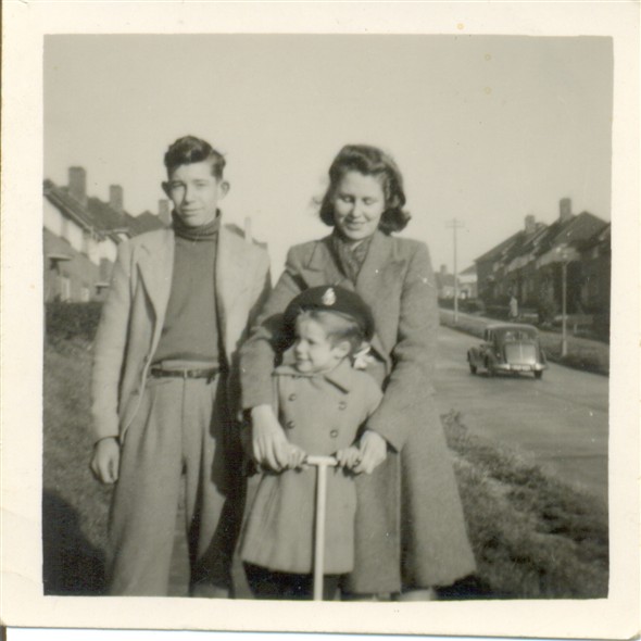 Photo:David Burtenshaw with sisters, Peggy, 4/10/26 & Marion, 11/9/42, outside 29, Manor Rd,Brighton,1945