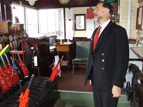 Photo:One of Bluebell Railway's friendly and courtious staff allowing us a peek into the signal box