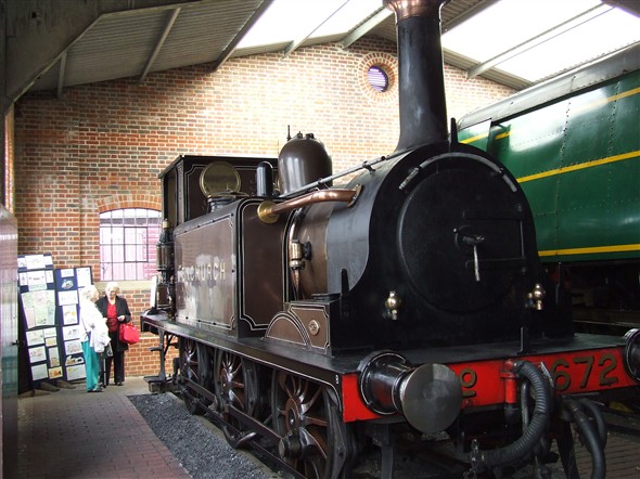 Photo:Two of our members admiring the Stroudley Terrier "Fenchurch" which at one time did shunting work at Brighton